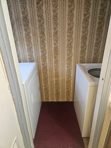 a bedroom with a bed and a mirror