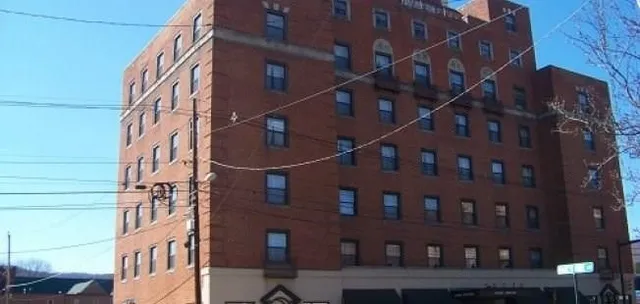 a kitchen with a refrigerator sink and cabinets