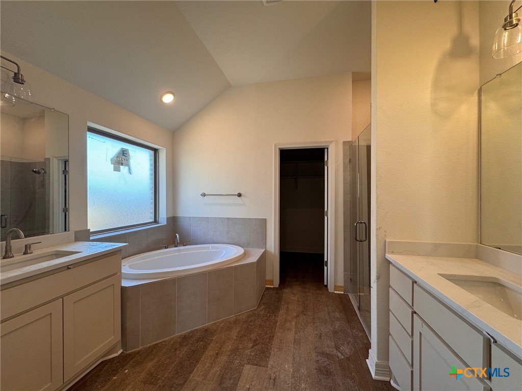 10712 Campsite Cove Temple, TX 76502 - Photo 7 of 11 a bathroom with a granite countertop sink and a mirror