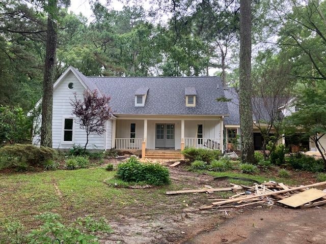 12211 Monterey Road Collierville, TN 38017 - Photo 2 of 4 a front view of house with yard and trees around