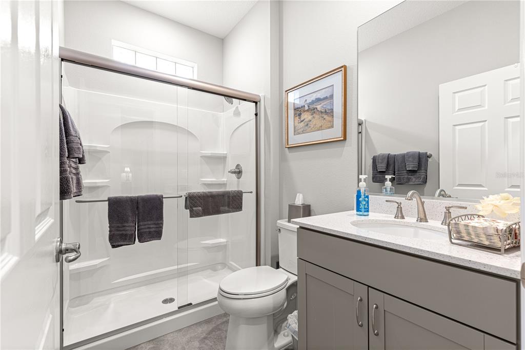 7641 Southwest 63rd Ln Road Ocala, FL 34474 - Photo 17 of 29 a bathroom with a sink a toilet and shower