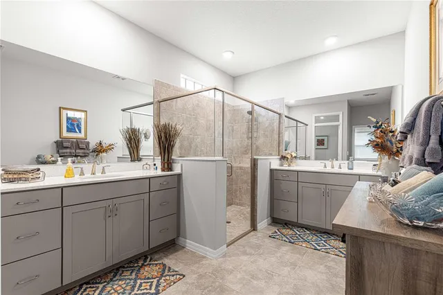 an aerial view of a swimming pool with outdoor seating