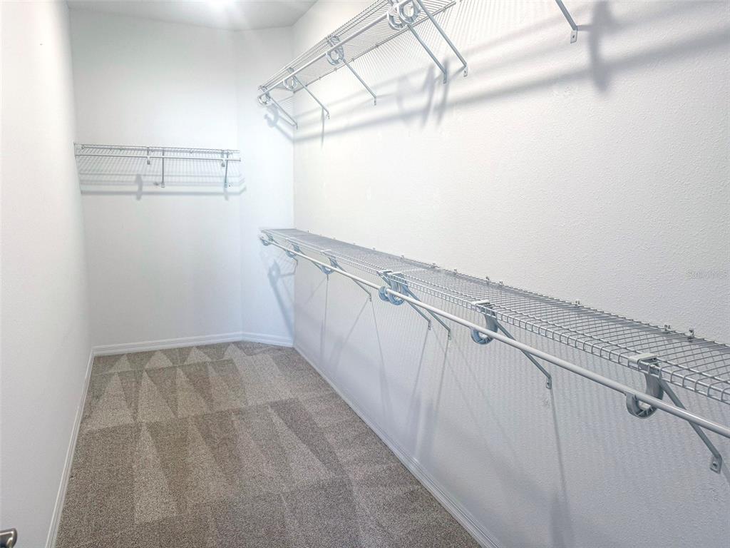 7641 Southwest 63rd Ln Road Ocala, FL 34474 - Photo 21 of 29 a view of a room with racks on the wall