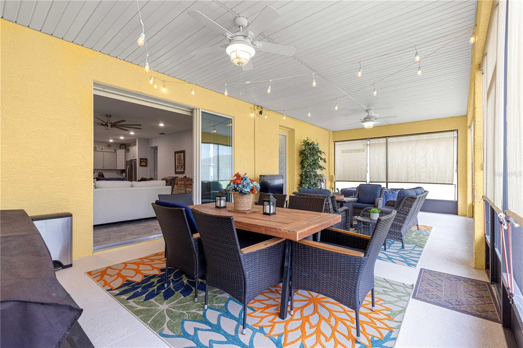 7641 Southwest 63rd Ln Road Ocala, FL 34474 - Photo 23 of 29 a view of a dining room with furniture window and wooden floor