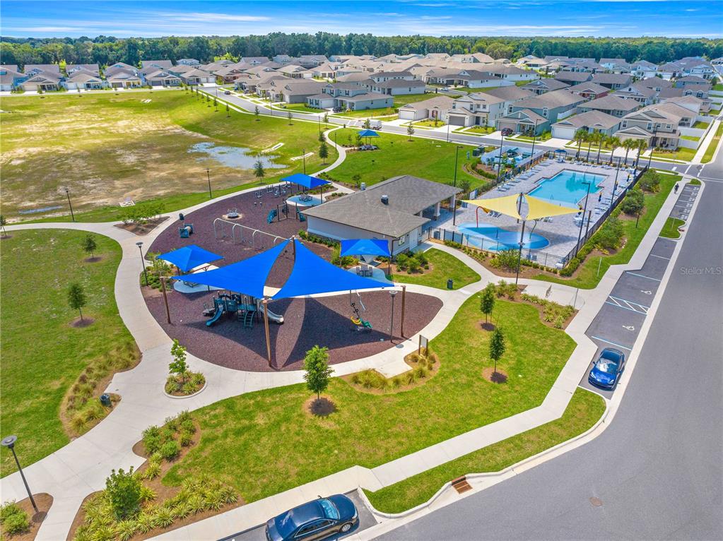 7641 Southwest 63rd Ln Road Ocala, FL 34474 - Photo 27 of 29 an aerial view of a swimming pool with outdoor seating