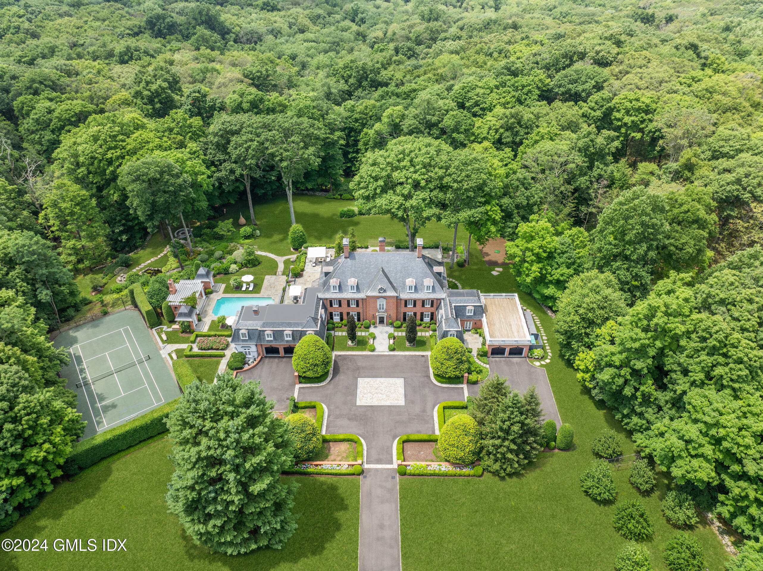 an aerial view of a house with a garden
