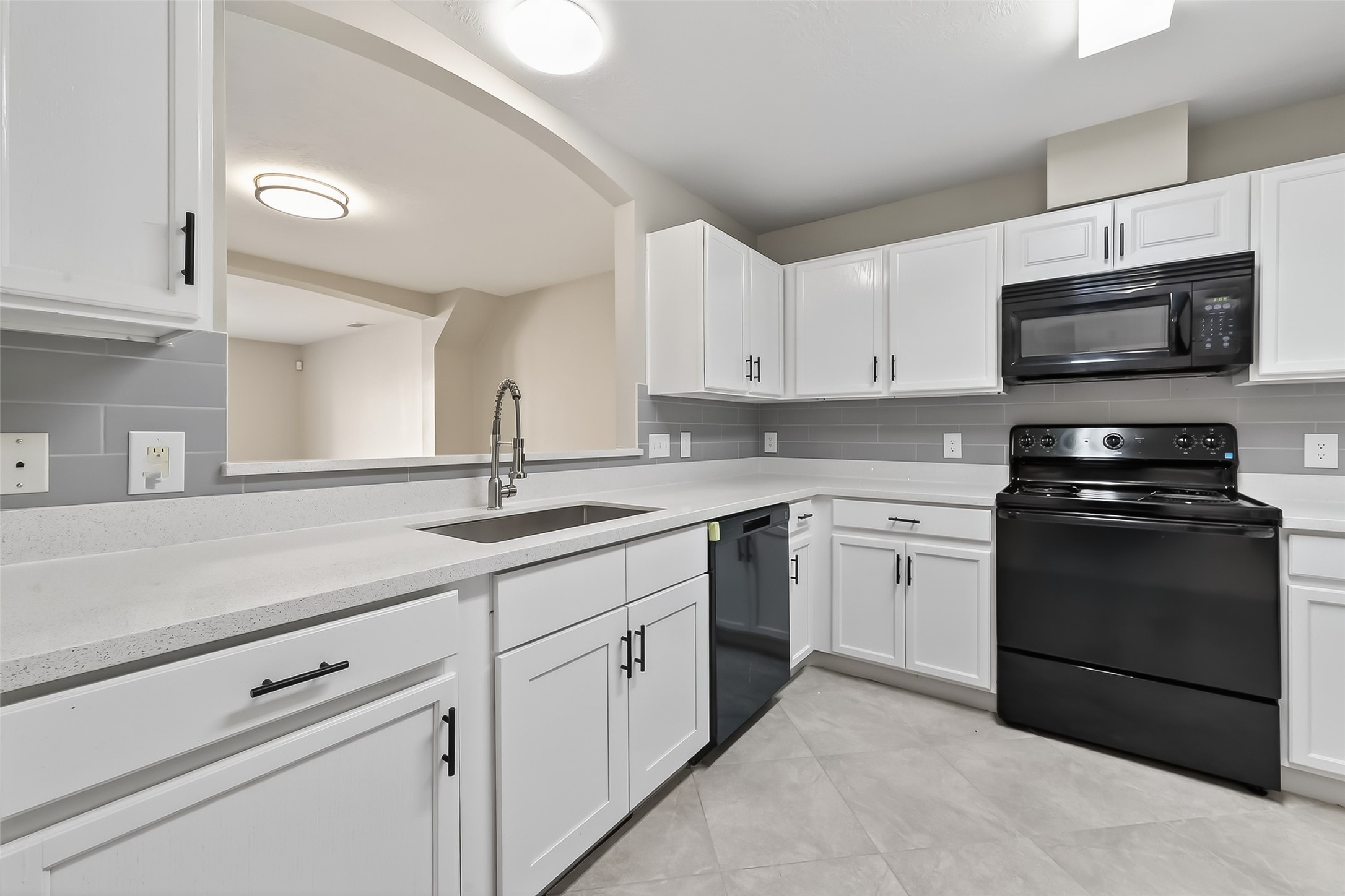 11735 Alief Clodine Road, Unit 36 Houston, TX 77072 - Photo 13 of 27 a kitchen with stainless steel appliances granite countertop a sink and a stove
