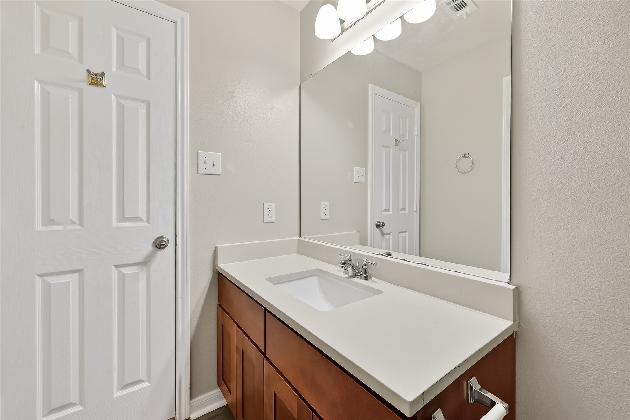 11735 Alief Clodine Road, Unit 36 Houston, TX 77072 - Photo 16 of 27 a bathroom with a sink vanity and a mirror