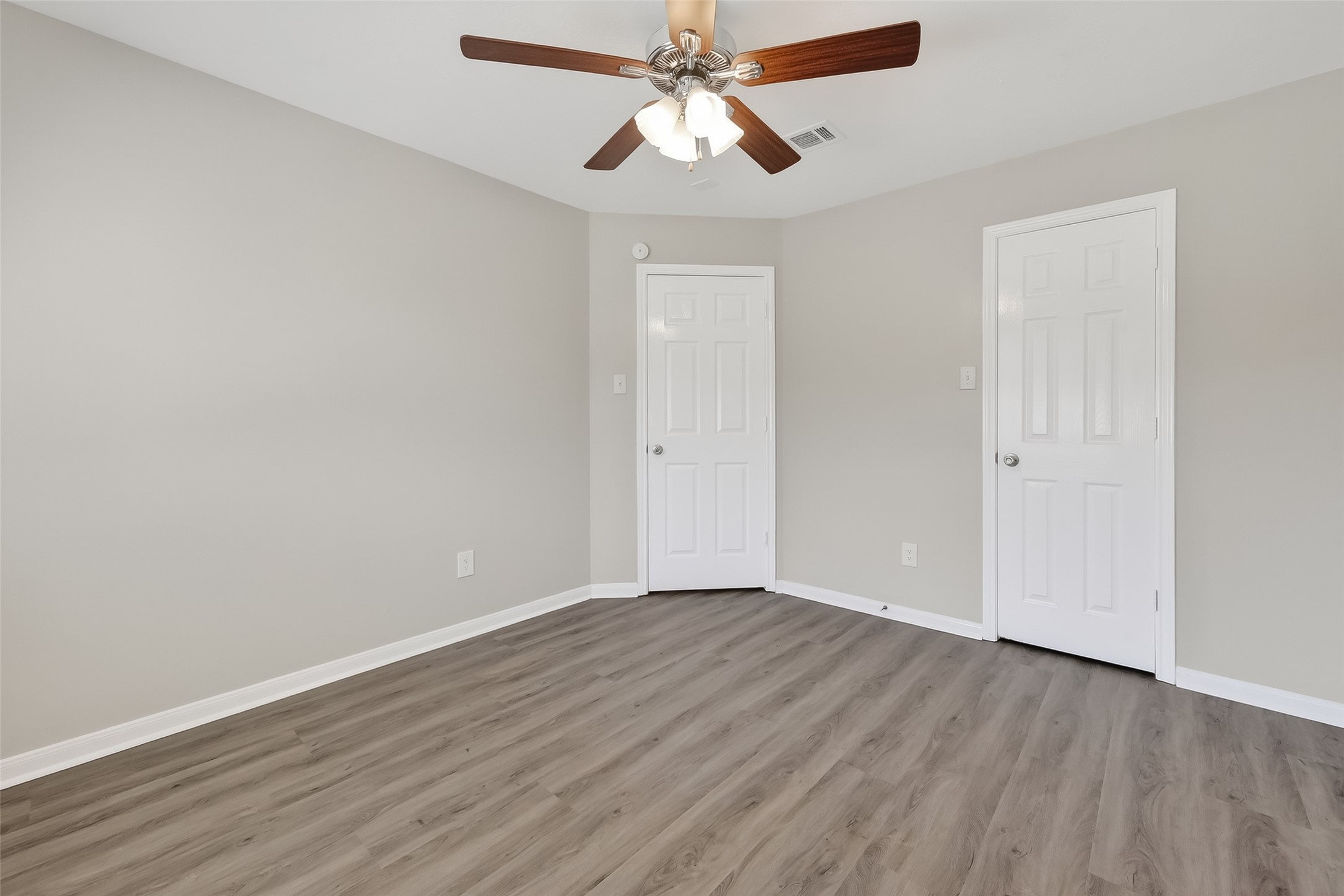11735 Alief Clodine Road, Unit 36 Houston, TX 77072 - Photo 20 of 27 a view of an empty room with wooden floor