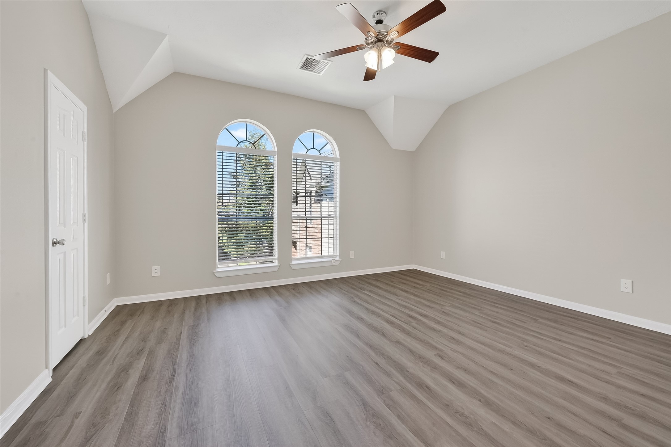 11735 Alief Clodine Road, Unit 36 Houston, TX 77072 - Photo 21 of 27 an empty room with wooden floor fan and windows