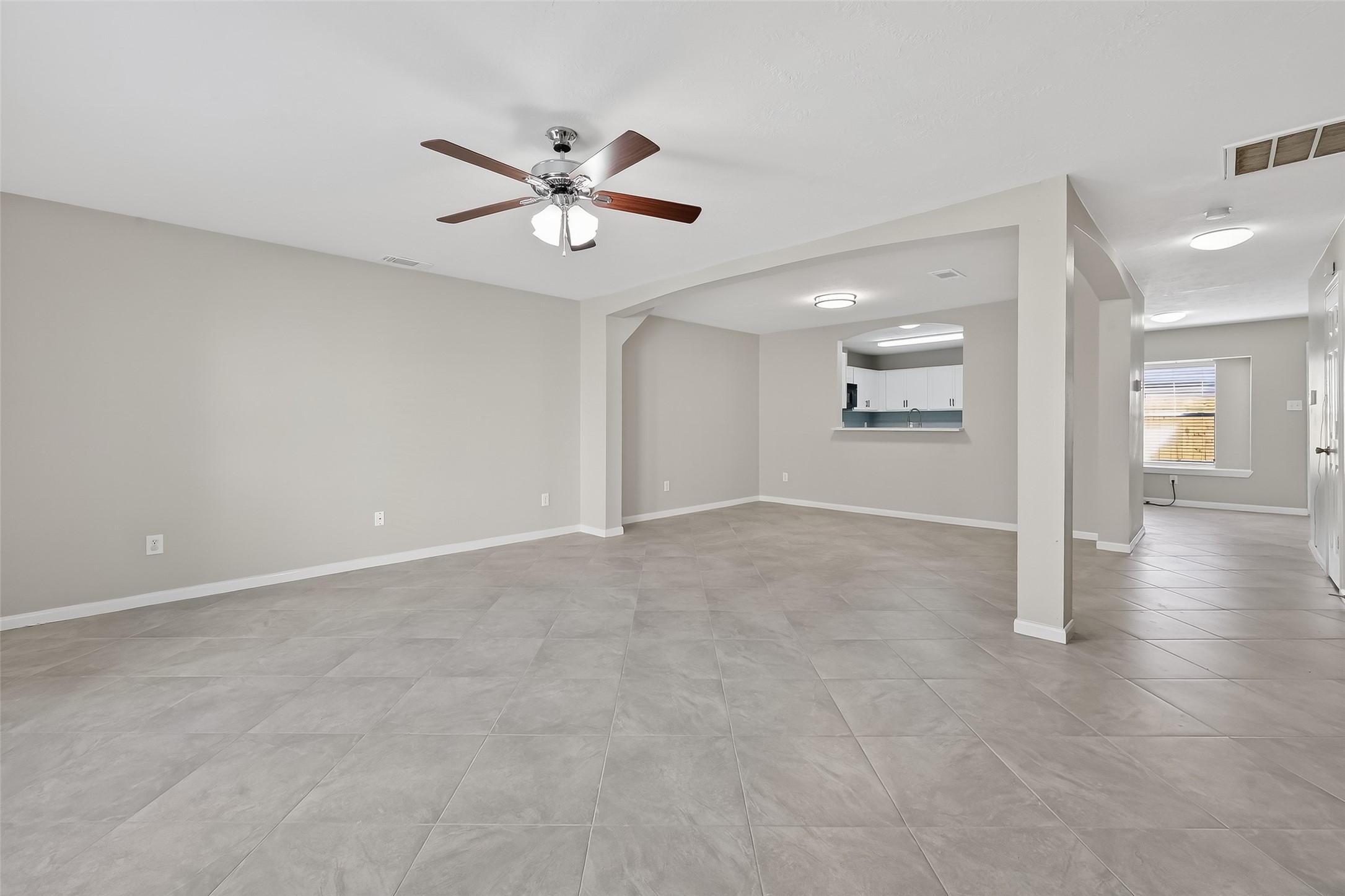 11735 Alief Clodine Road, Unit 36 Houston, TX 77072 - Photo 4 of 27 a view of a livingroom with a ceiling fan and window