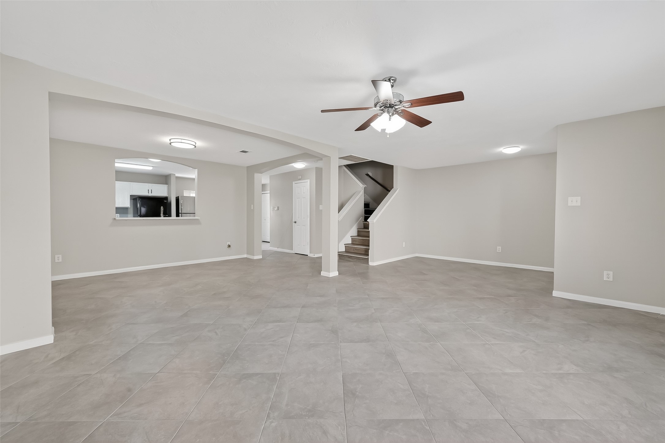 11735 Alief Clodine Road, Unit 36 Houston, TX 77072 - Photo 7 of 27 a view of a livingroom with a ceiling fan and window