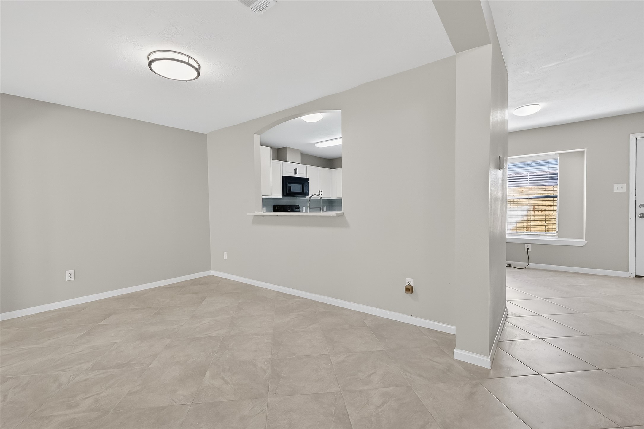 11735 Alief Clodine Road, Unit 36 Houston, TX 77072 - Photo 9 of 27 a view of an empty room with a window