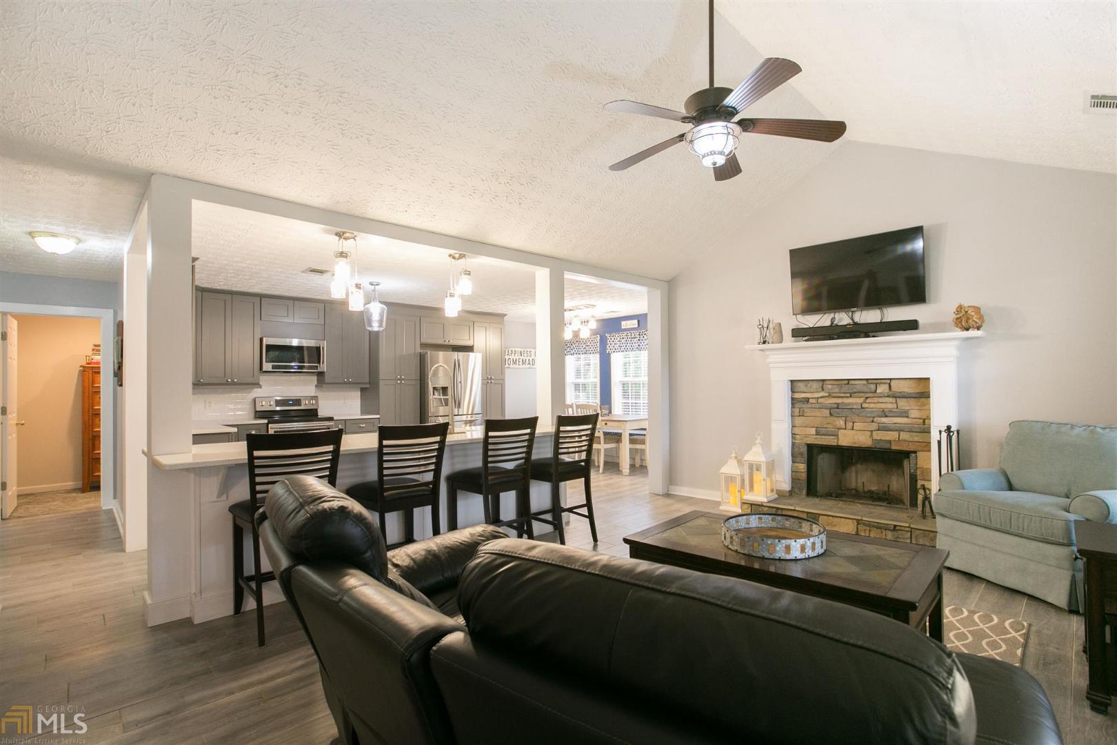 409 Candler Road Williamson, GA 30292 - Photo 1 of 1 a living room with furniture fireplace and flat screen tv