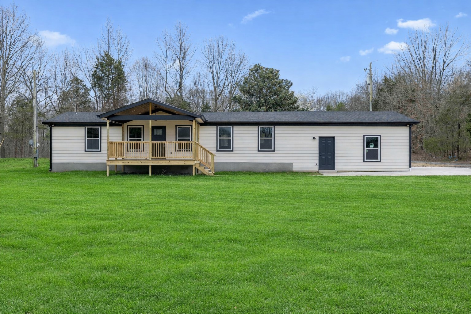 a view of a house with a backyard