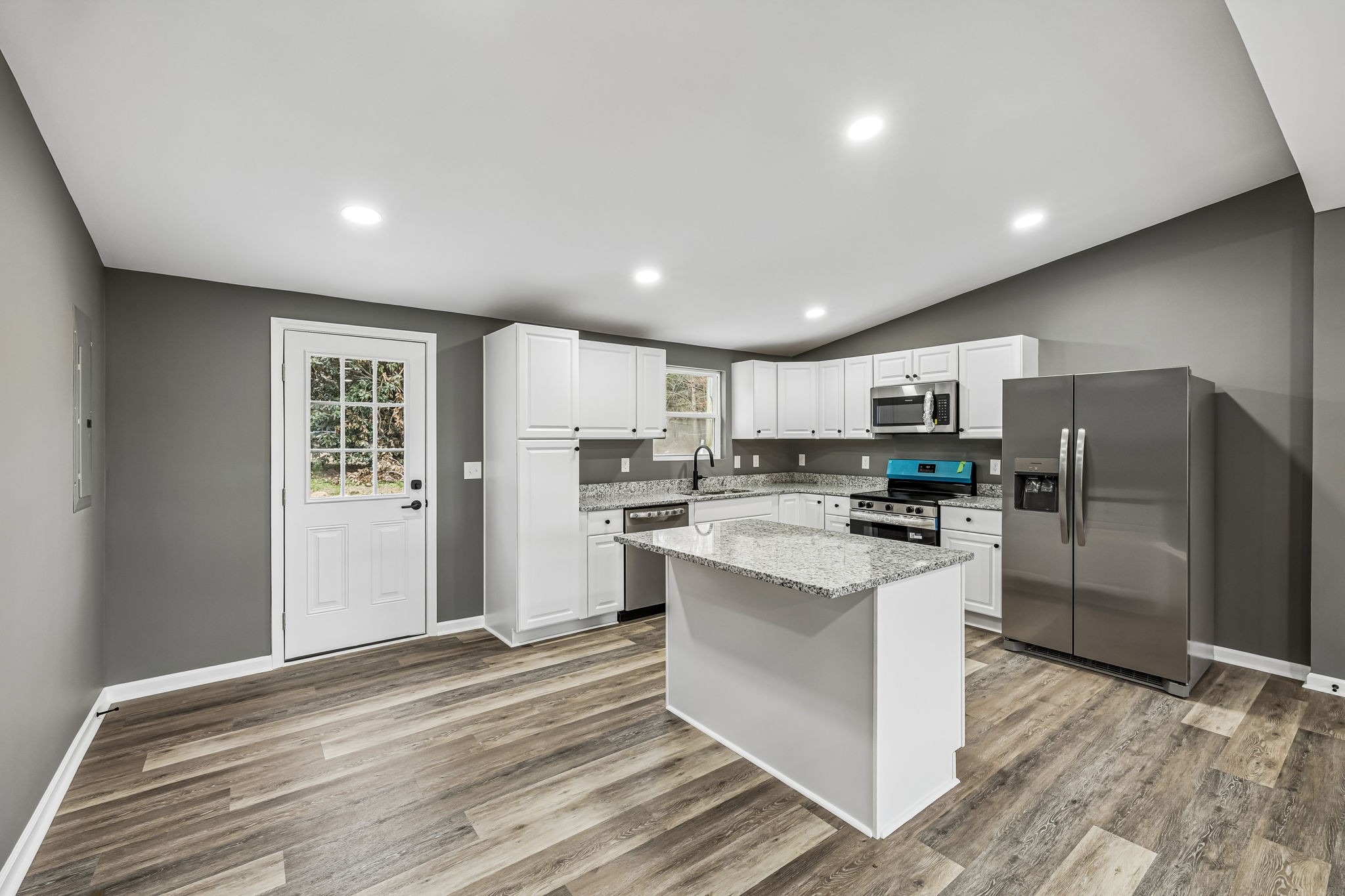 1985 Mosley Ferry Road Chapmansboro, TN 37035 - Photo 11 of 24 a kitchen with refrigerator and cabinets