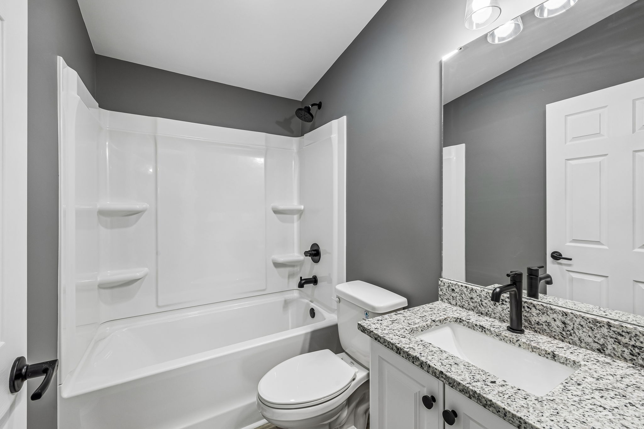 1985 Mosley Ferry Road Chapmansboro, TN 37035 - Photo 19 of 24 a bathroom with a granite countertop sink a toilet and shower