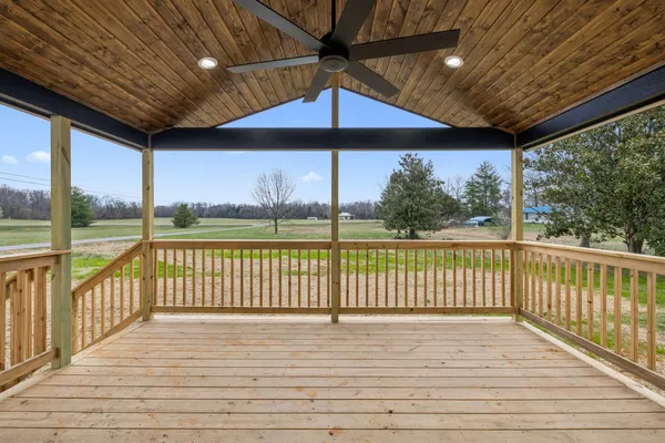 a view of a balcony with wooden floor