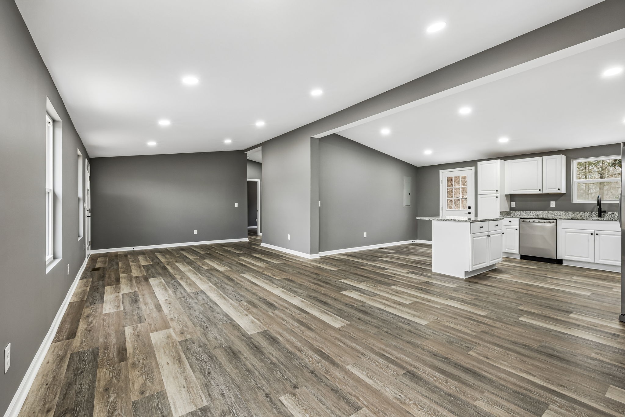 1985 Mosley Ferry Road Chapmansboro, TN 37035 - Photo 7 of 24 a view of a kitchen with kitchen island wooden floor center island and stainless steel appliances