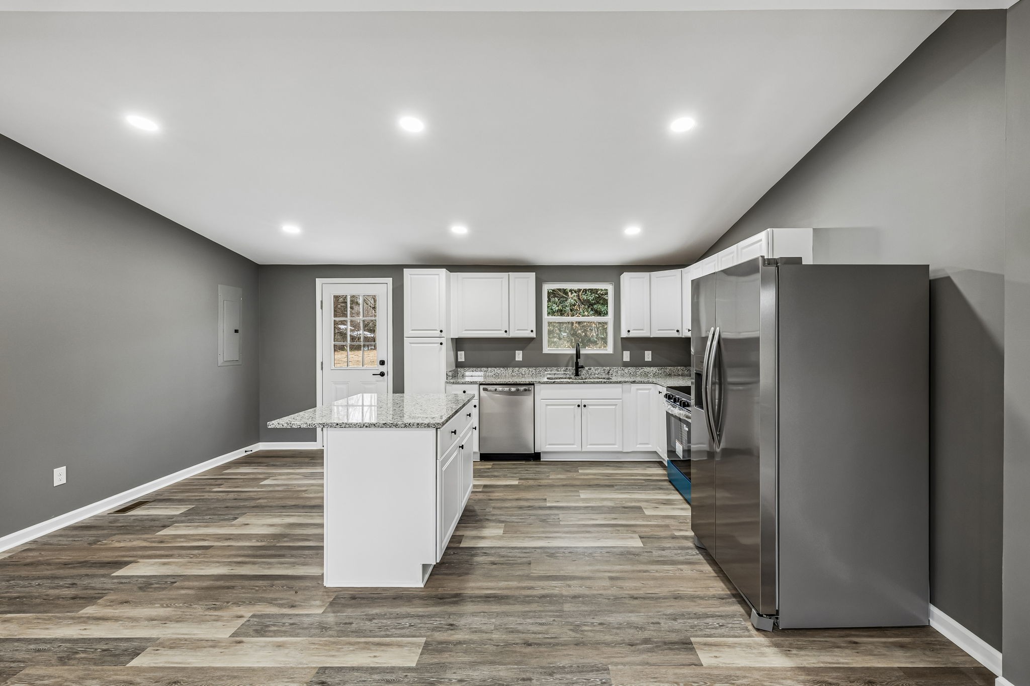 1985 Mosley Ferry Road Chapmansboro, TN 37035 - Photo 9 of 24 a kitchen with white cabinets and stainless steel appliances