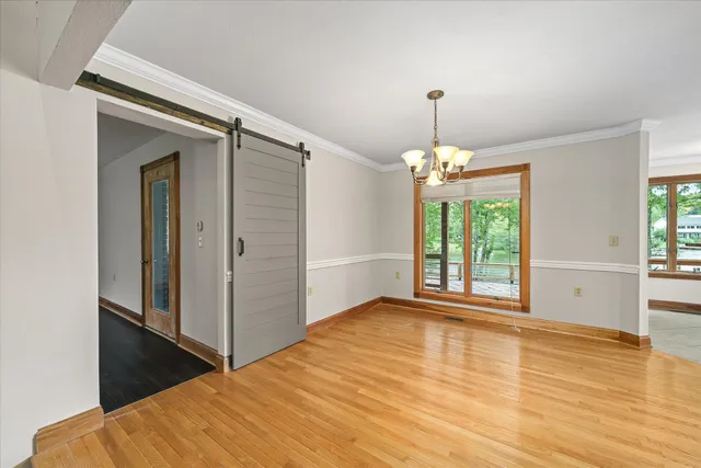a kitchen with granite countertop a sink and a wooden floor