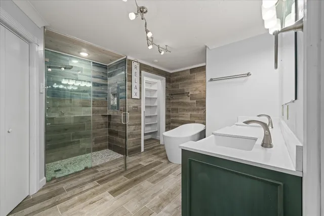 a bathroom with a granite countertop sink toilet and mirror
