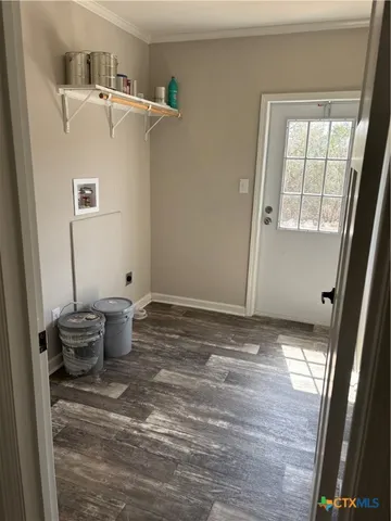 a view of a room with wooden floor and sink