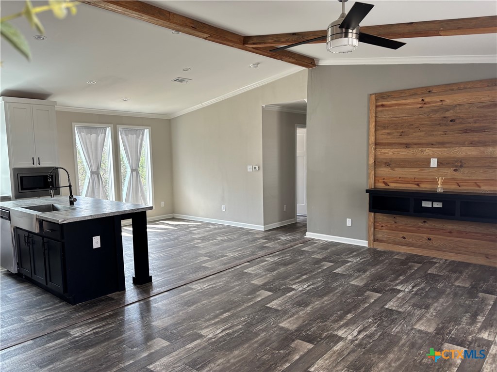 320 Fawn Drive Spring Branch, TX 78070 - Photo 5 of 16 a view of kitchen with wooden floor and windows