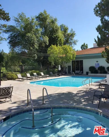 a view of backyard with seating space