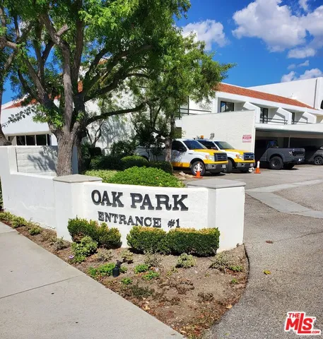 a view of street with parked cars