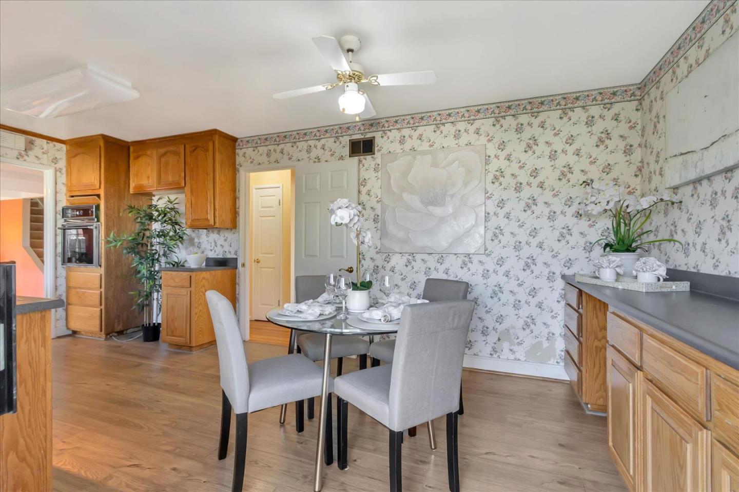 727 Valley Way Santa Clara, CA 95051 - Photo 12 of 52 a view of a dining room with furniture window and wooden floor