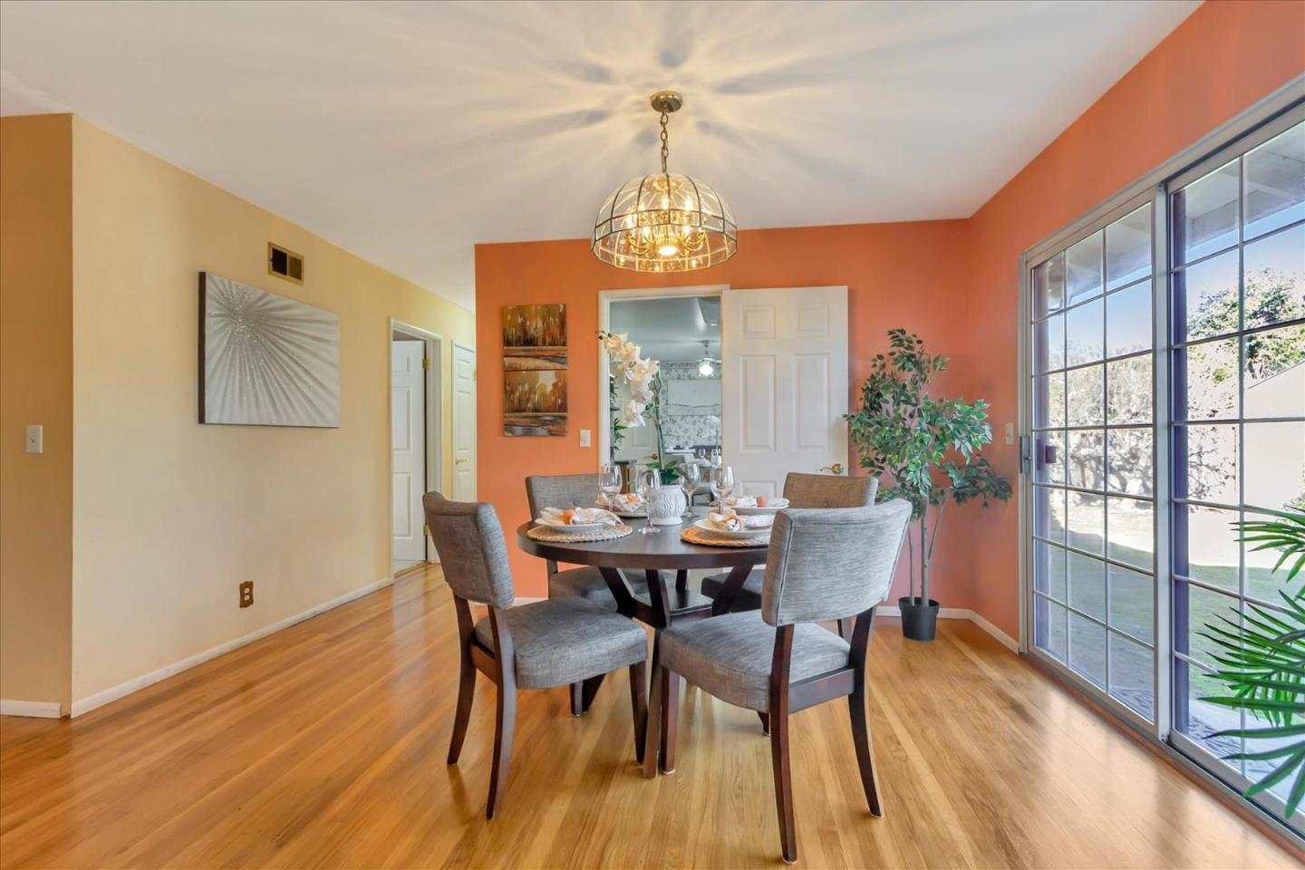 727 Valley Way Santa Clara, CA 95051 - Photo 16 of 52 a view of a dining room with furniture wooden floor and a chandelier