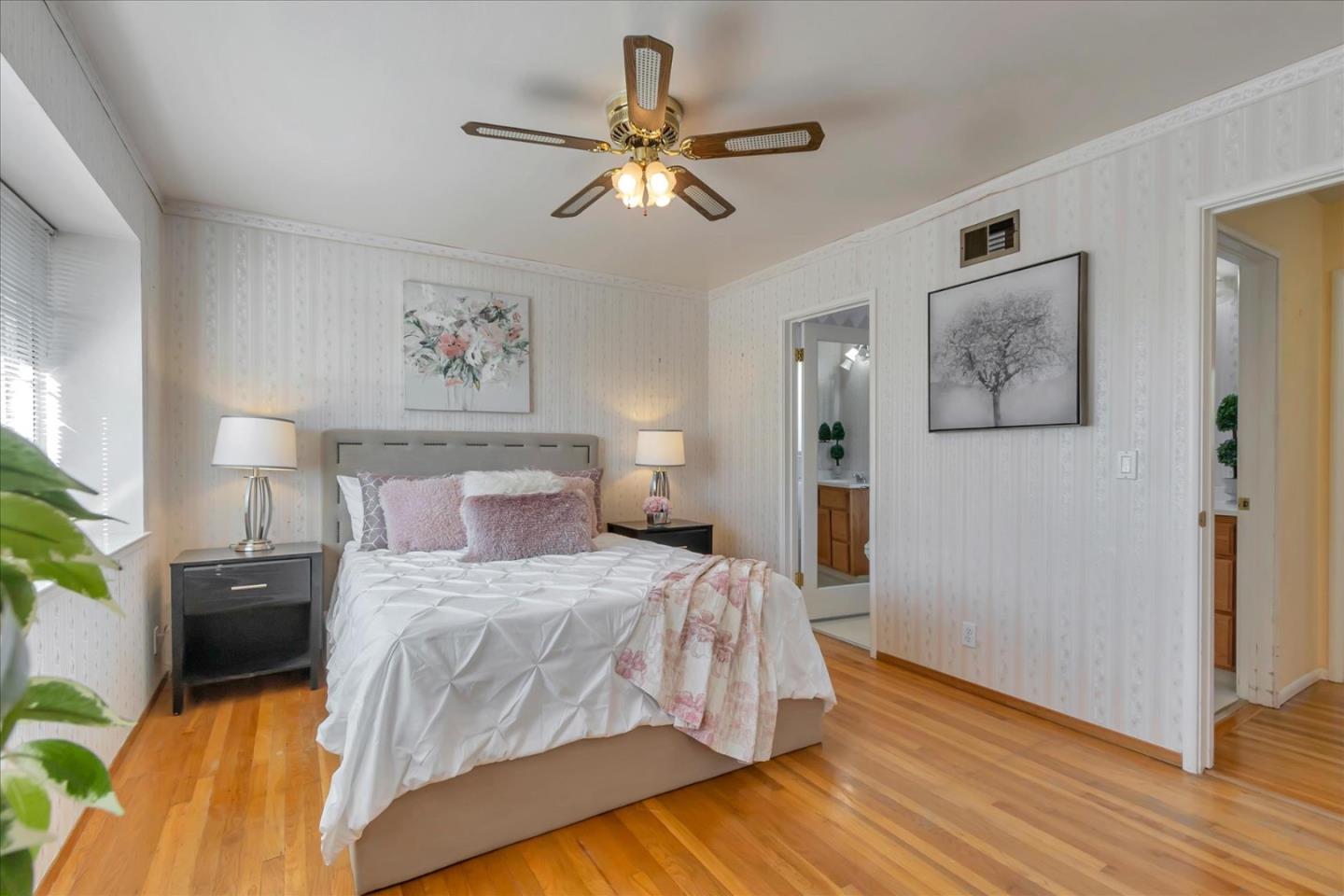 727 Valley Way Santa Clara, CA 95051 - Photo 18 of 52 a bedroom with a bed and wooden floor