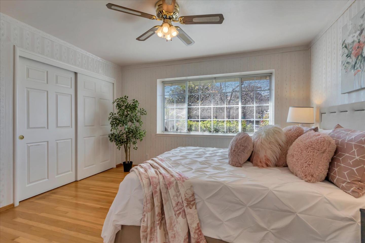 727 Valley Way Santa Clara, CA 95051 - Photo 21 of 52 a bedroom with a large bed and a window