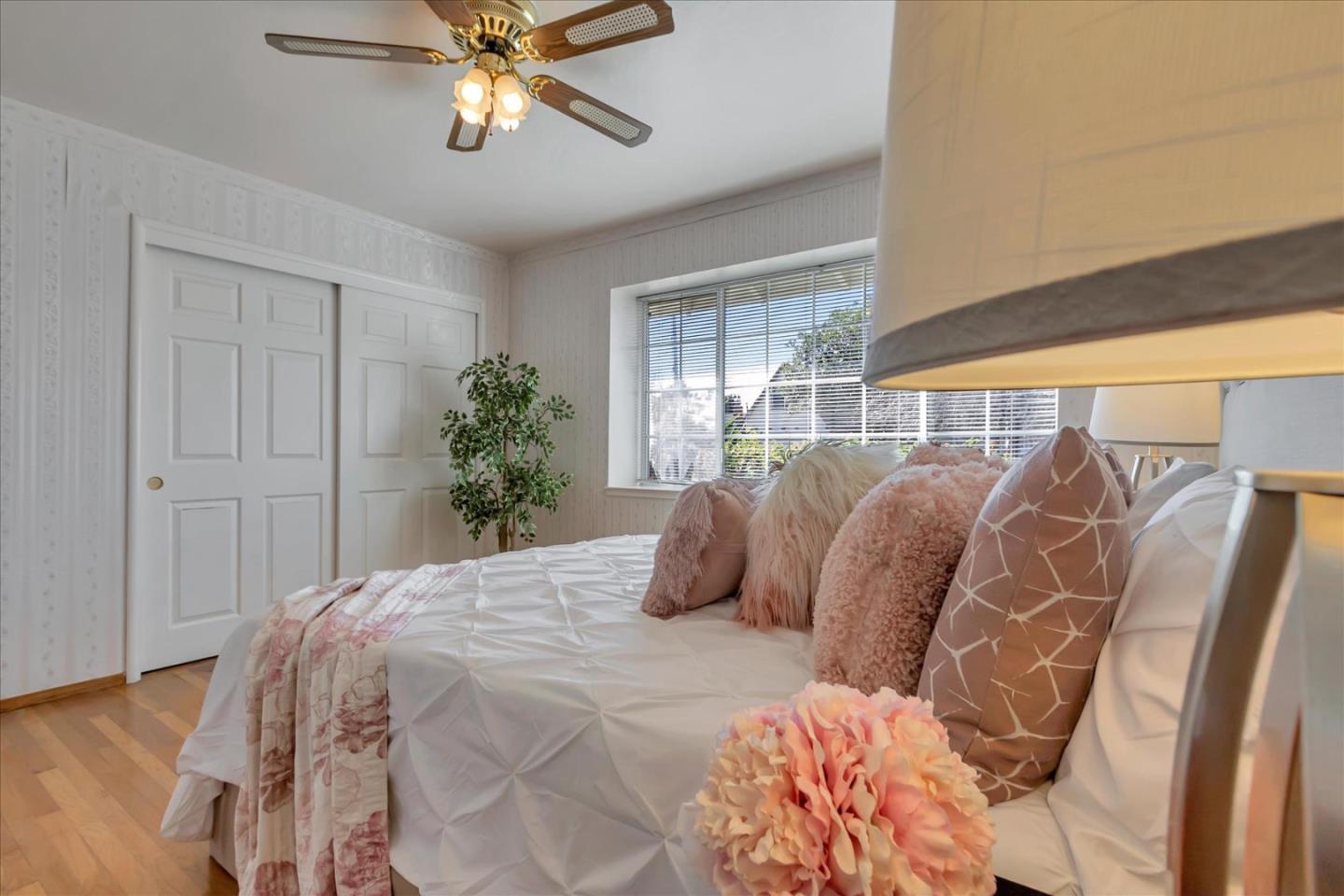 727 Valley Way Santa Clara, CA 95051 - Photo 22 of 52 a bedroom with a large bed and a window