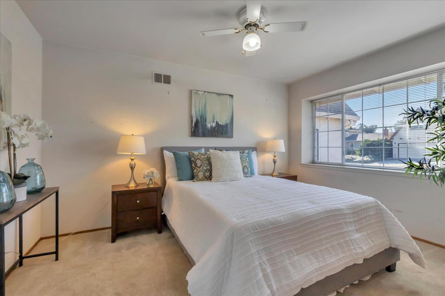 727 Valley Way Santa Clara, CA 95051 - Photo 23 of 52 a bedroom with a large bed and a window