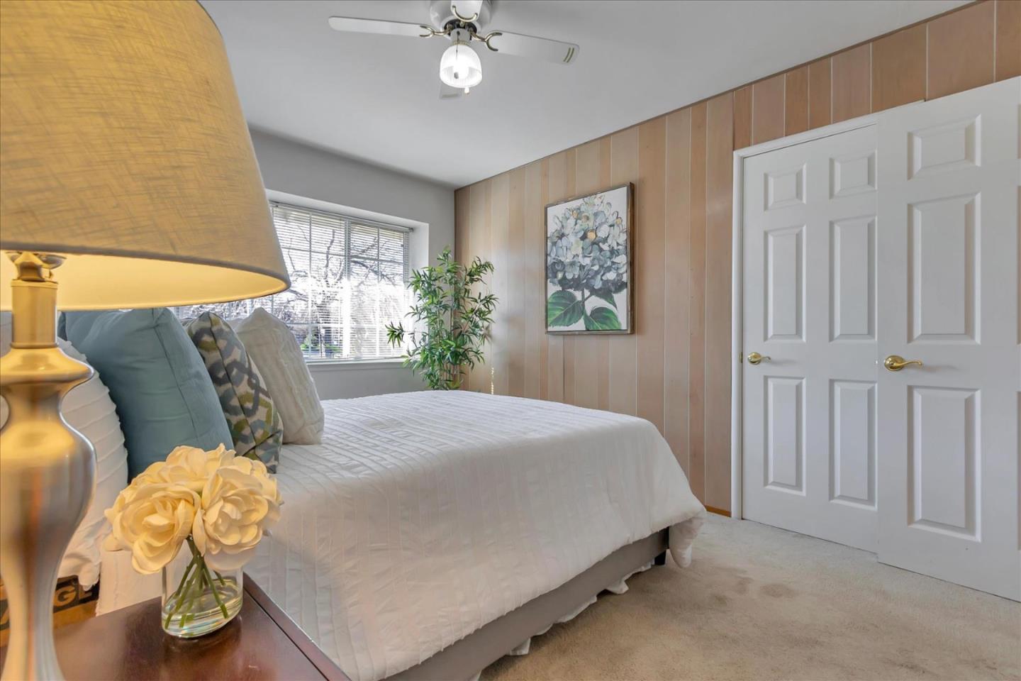 727 Valley Way Santa Clara, CA 95051 - Photo 24 of 52 a bed sitting in a bedroom next to a window