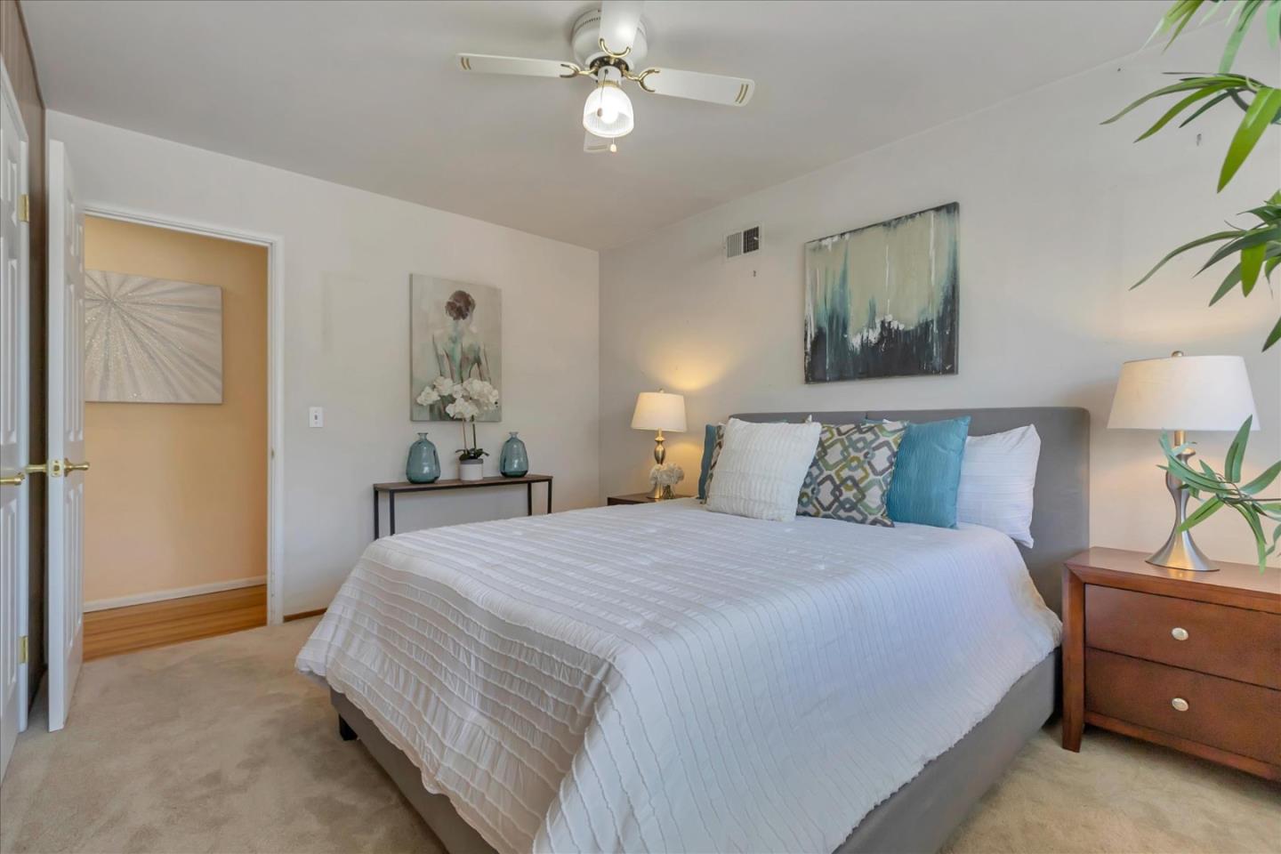 727 Valley Way Santa Clara, CA 95051 - Photo 25 of 52 a bedroom with a bed and a chandelier