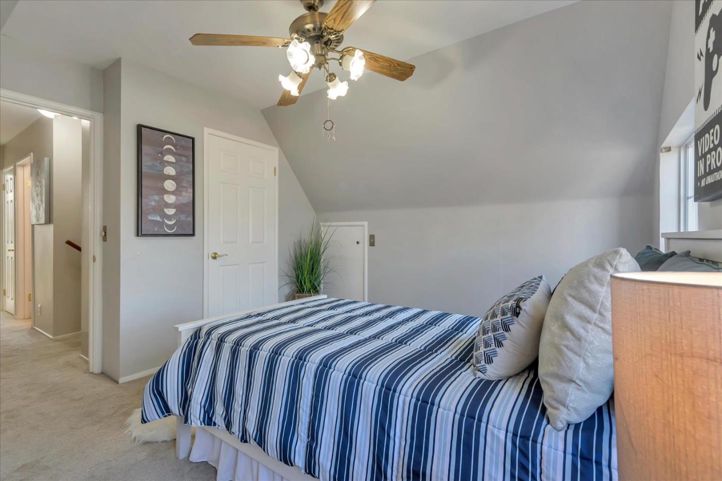 727 Valley Way Santa Clara, CA 95051 - Photo 34 of 52 a bedroom with a bed and a chandelier