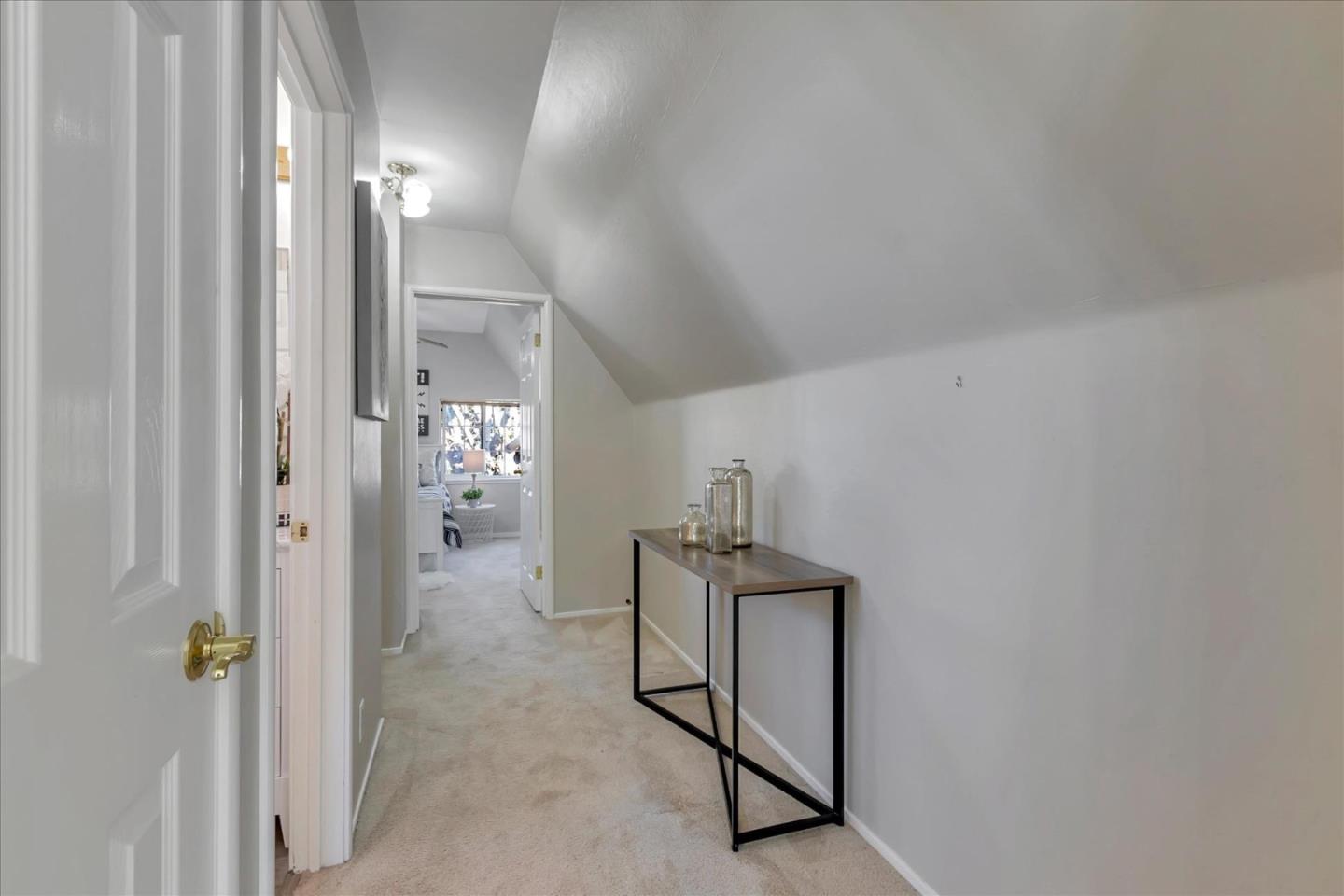 727 Valley Way Santa Clara, CA 95051 - Photo 37 of 52 a view of a hallway with paintings on the wall