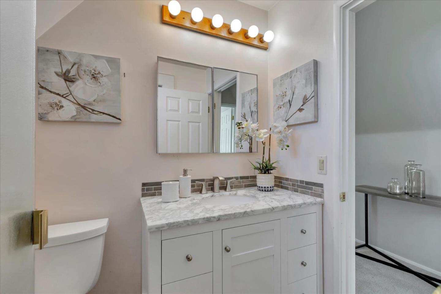 727 Valley Way Santa Clara, CA 95051 - Photo 40 of 52 a bathroom with a granite countertop sink mirror and toilet
