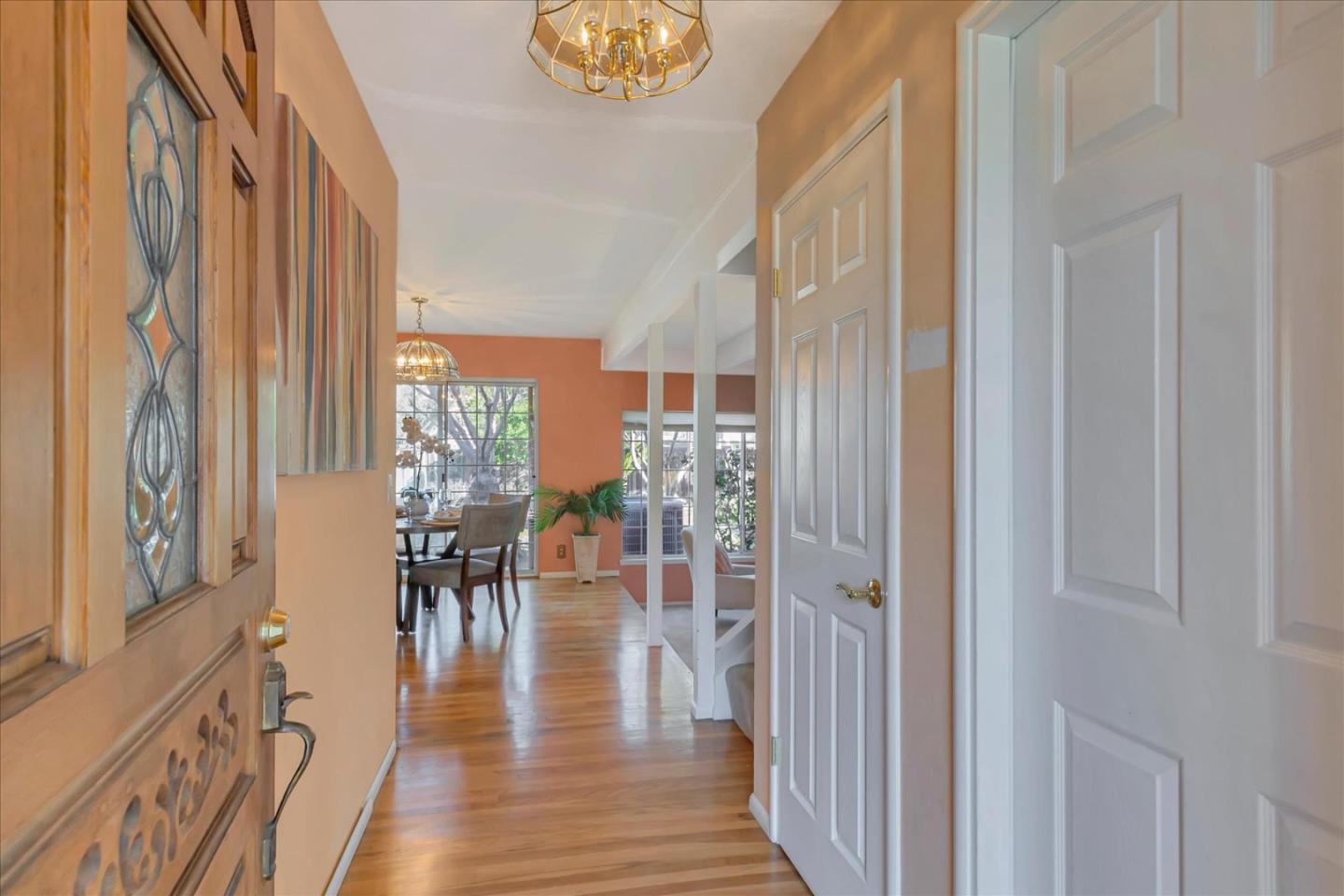 727 Valley Way Santa Clara, CA 95051 - Photo 4 of 52 a view of a hallway with wooden floor and windows