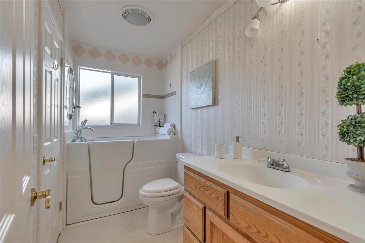 727 Valley Way Santa Clara, CA 95051 - Photo 43 of 52 a bathroom with a granite countertop sink a toilet and a mirror
