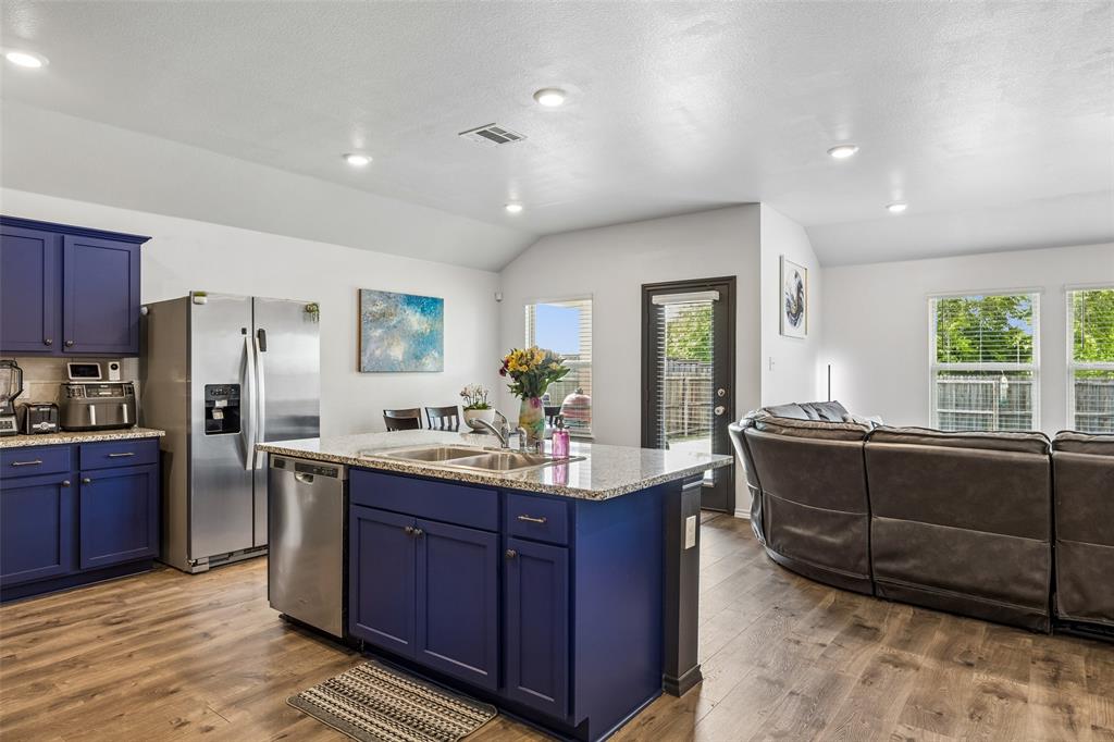 802 Rustic Way Royse City, TX 75189 - Photo 3 of 38 a living room with stainless steel appliances granite countertop furniture a sink a counter space and a window