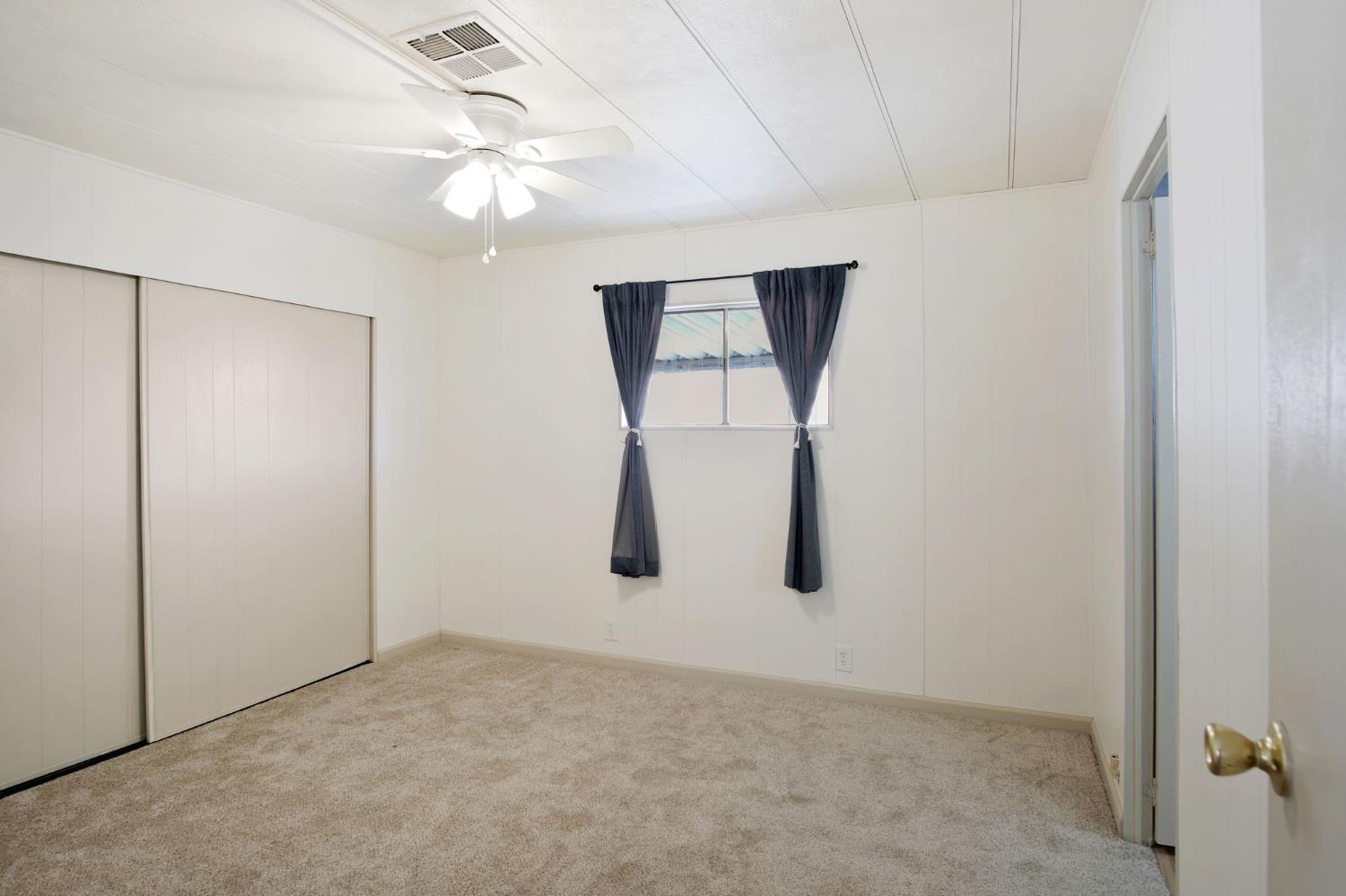 2621 Prescott Road, Unit 224 224 Modesto, CA 95350 - Photo 16 of 23 an empty room with chandelier fan