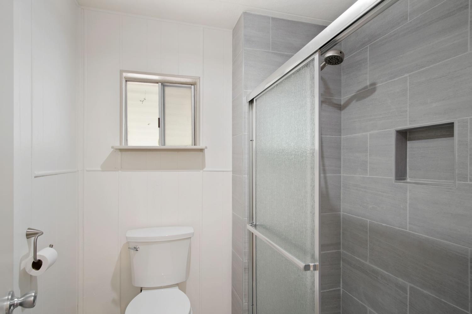 2621 Prescott Road, Unit 224 224 Modesto, CA 95350 - Photo 23 of 23 a bathroom with a toilet and a shower