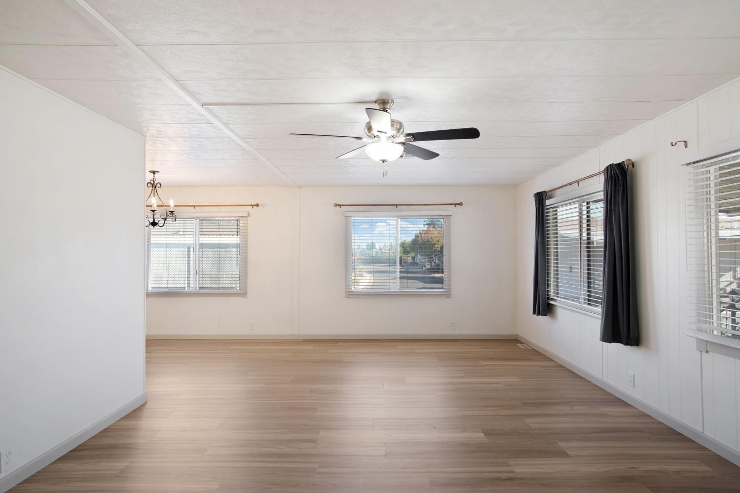 2621 Prescott Road, Unit 224 224 Modesto, CA 95350 - Photo 6 of 23 wooden floor in an empty room with a window