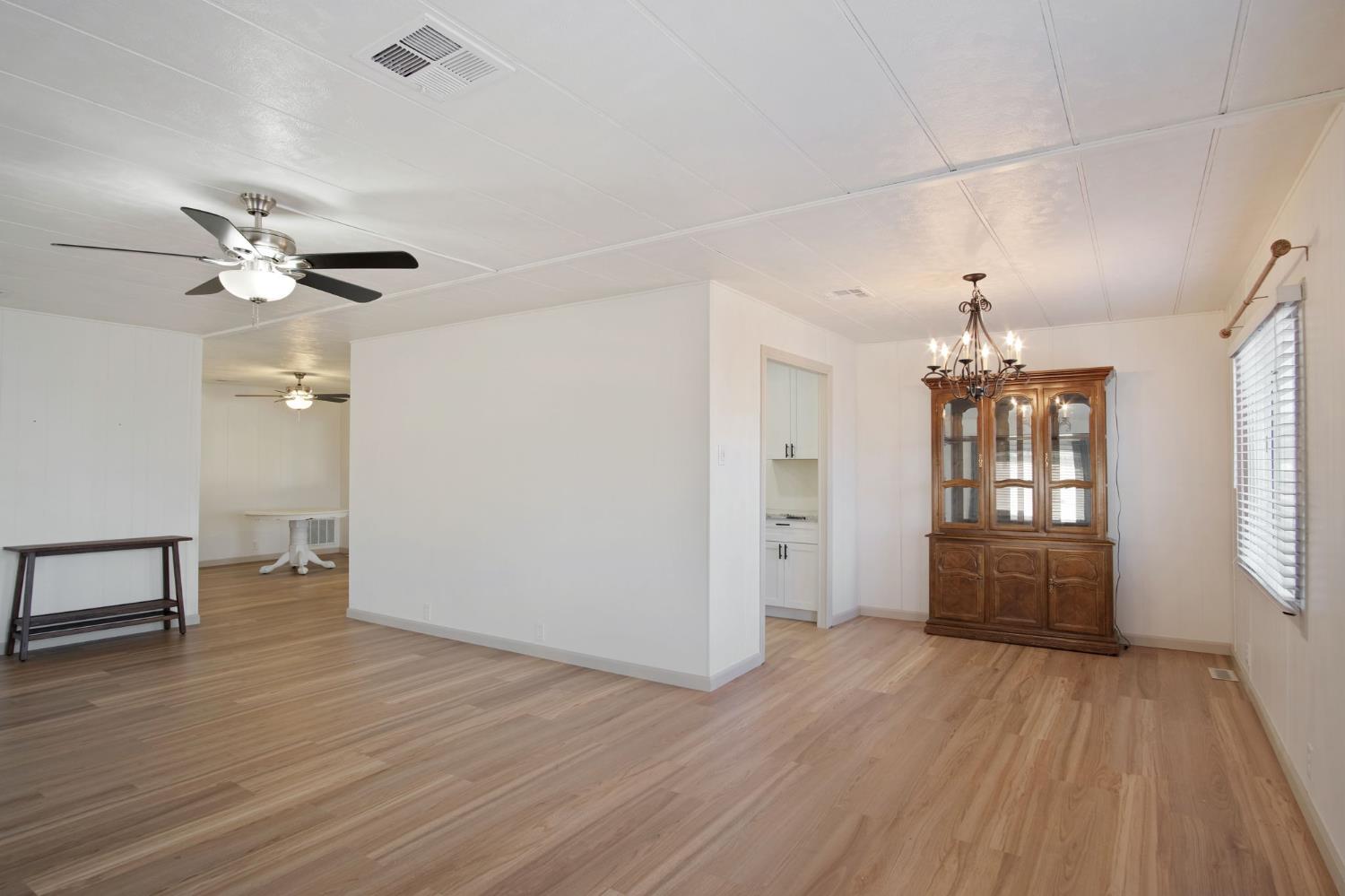 2621 Prescott Road, Unit 224 224 Modesto, CA 95350 - Photo 8 of 23 an empty room with wooden floor and windows