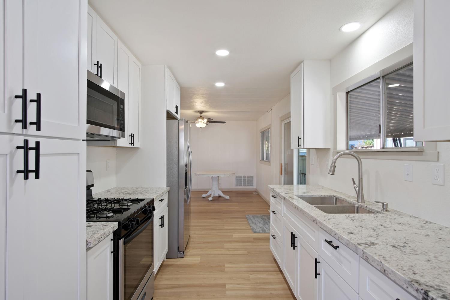 2621 Prescott Road, Unit 224 224 Modesto, CA 95350 - Photo 10 of 23 a large kitchen with a stove and a sink