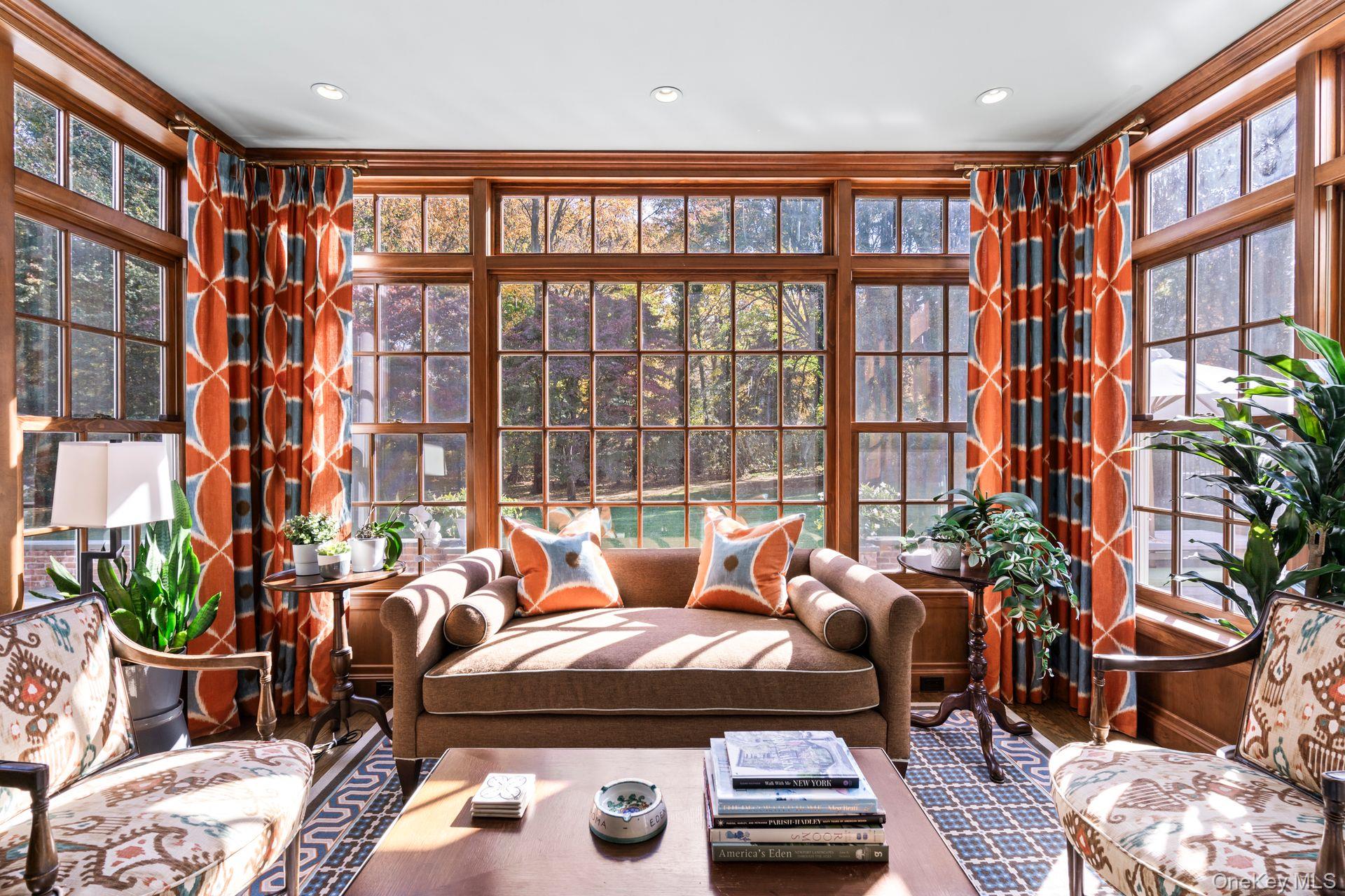 30 Underhill Road Locust Valley, NY 11560 - Photo 13 of 32 a living room with furniture and a potted plant